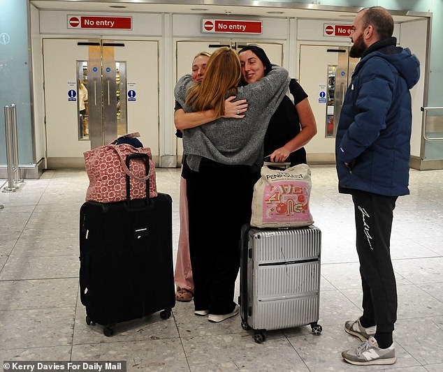 Emotional scenes as Ghislaine Norman greets her two daughter Paris and Rihanna,30 and 28, arriving back at Heathrow from Dubai