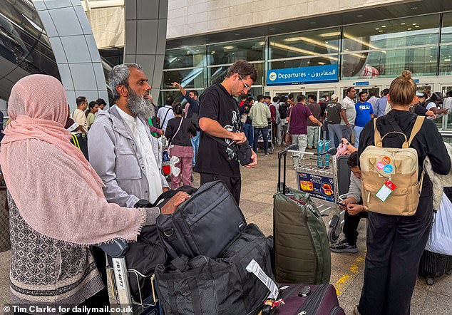DUBAI: Dubai Airport this morning as passengers queue to board flights out of the warzone