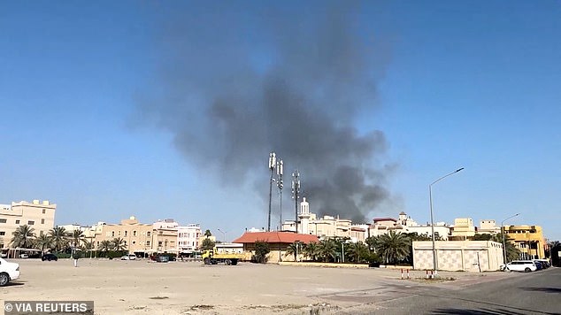 All four Army Reserve soldiers were killed Sunday when a drone hit a command center in Port Shuaiba, Kuwait. Smoke is seen rising from an area surrounding the US Embassy following a strike in Kuwait on Monday