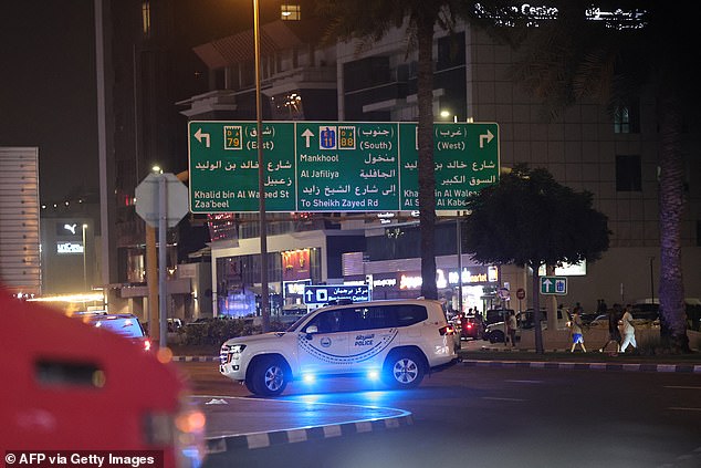 Local emergency services managed to extinguish the fire a short time later and no one was hurt (Pictured: The scene outside the Consulate building this evening)