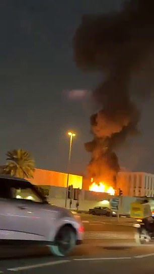 The US Consulate building in Dubai was up in flames on Tuesday after reportedly being struck by an Iranian drone