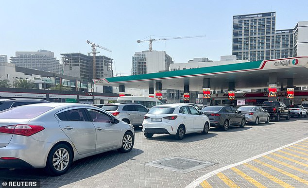Cars queue outside a petrol station in Dubai on March 1 after attacks on Iran began and expats try to flee