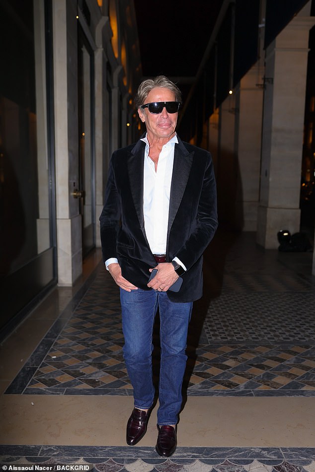 He was smartly dressed in jeans, a crisp white shirt and a black blazer worn with loafers as he linked arms with his plus one for the evenin