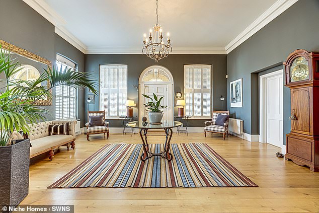 Upon entering the home, guests are met with a grand hall, fit with a 11 foot ceiling