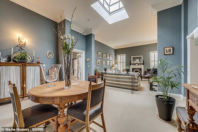 A dual-aspect lounge and dining room dining encompasses the centre of the house