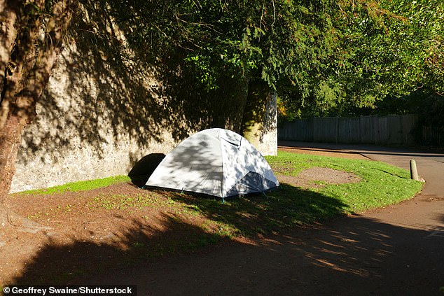 A homeless tent by Winchester Castle's wall in 2022. People from the surrounding villages have raised concerns about public drunkenness, aggressive begging and a 'threatening atmosphere'