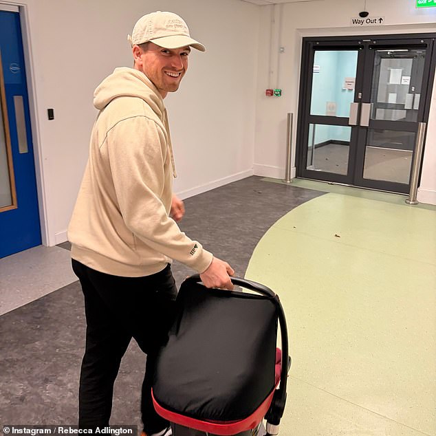 Rebecca also shared a sweet snap of her husband Andy with little Thea as they headed home from the hospital