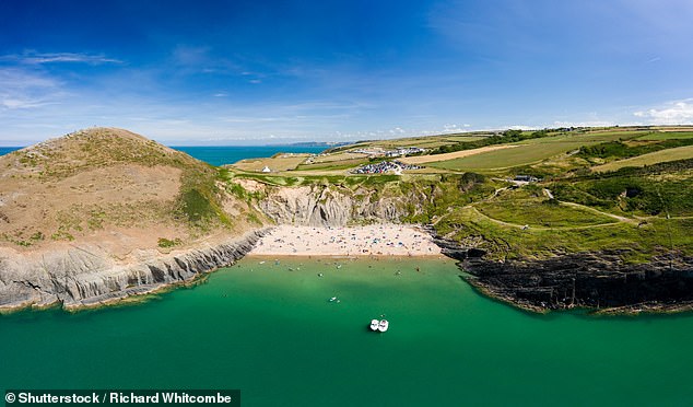 The sandy beach and headland at Mwnt in Wales offers dramatic scenery