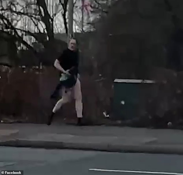 Carrying what appears to be his trousers in his hand, Richards furtively looks around