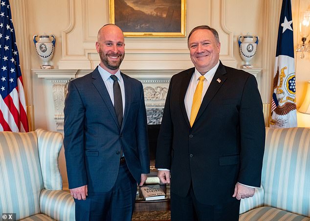Yaakov Katz, an American-born Israeli journalist (pictured with former Secretary of State Mike Pompeo), told the Daily Mail that the missile interception systems 'allows life to go on here, even in the face of danger'