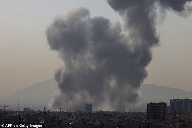 A second wave then destroyed Iran's air-defence batteries, before 200 Israeli aircraft swept across Iran and began hammering ballistic-missile depots, silos, mobile launchers and production facilities. Pictured: Smoke rises above the capital Tehran after an explosion on February 28