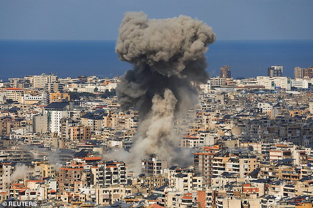 Fighting also continued between Hezbollah and Israeli troops in southern Lebanon. Pictured: Smoke rises after an Israeli strike on Beirut's southern suburbs after an escalation between Hezbollah and Israel on Wednesday