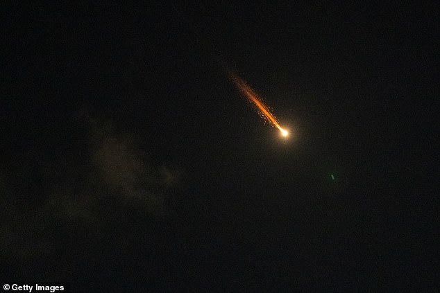 Iran continued striking its neighbours on Wednesday, including Iraq, Turkey, Saudi Arabia, Kuwait and Israel. Pictured: Sparks from a missile interception in Tel Aviv, Israel, on Wednesday