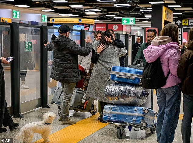 Happy scenes as the Italian government's rescue flight from Abu Dhabi arrives at Fiumicino Airport