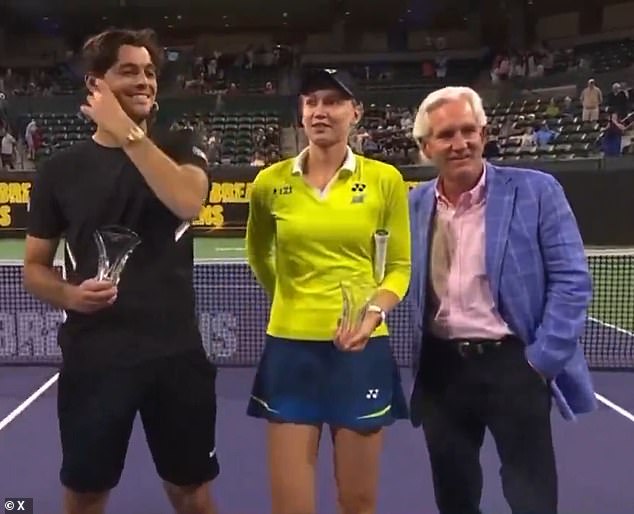 In awkward scenes, the two-time Grand Slam champion was spotted nudging Renker's hand away as the cameras kept rolling