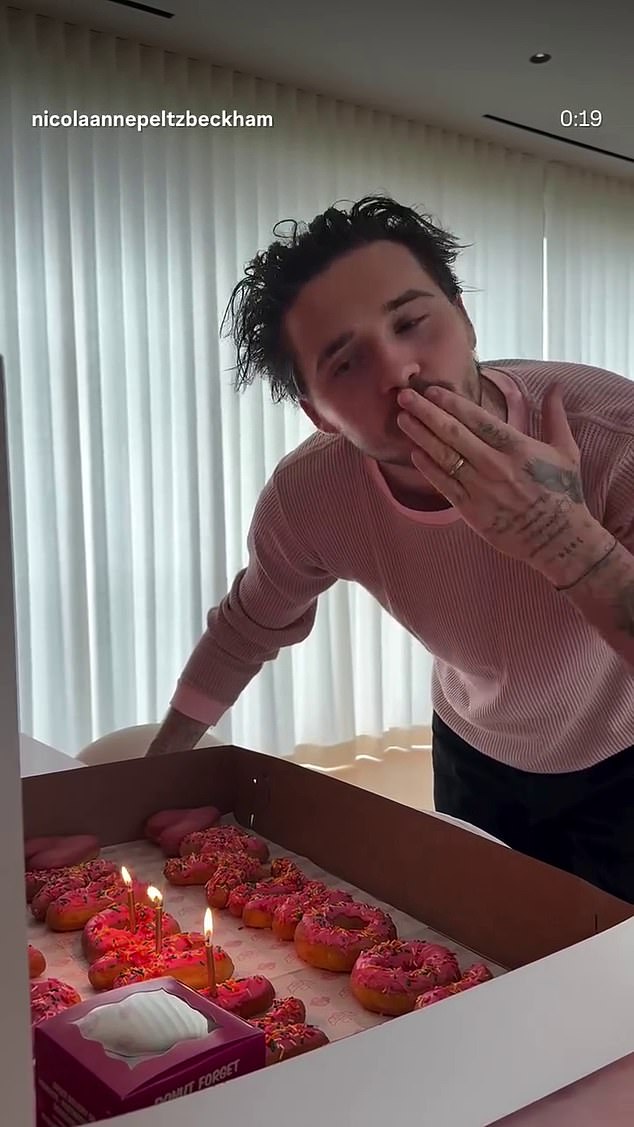 Brooklyn spent the day with his wife Nicola, 31, who shared a video of her husband blowing out his candles on a box of doughnuts