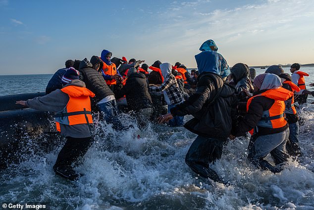 Migrants jostled for a spot on the dangeroudly overcrowded dingies