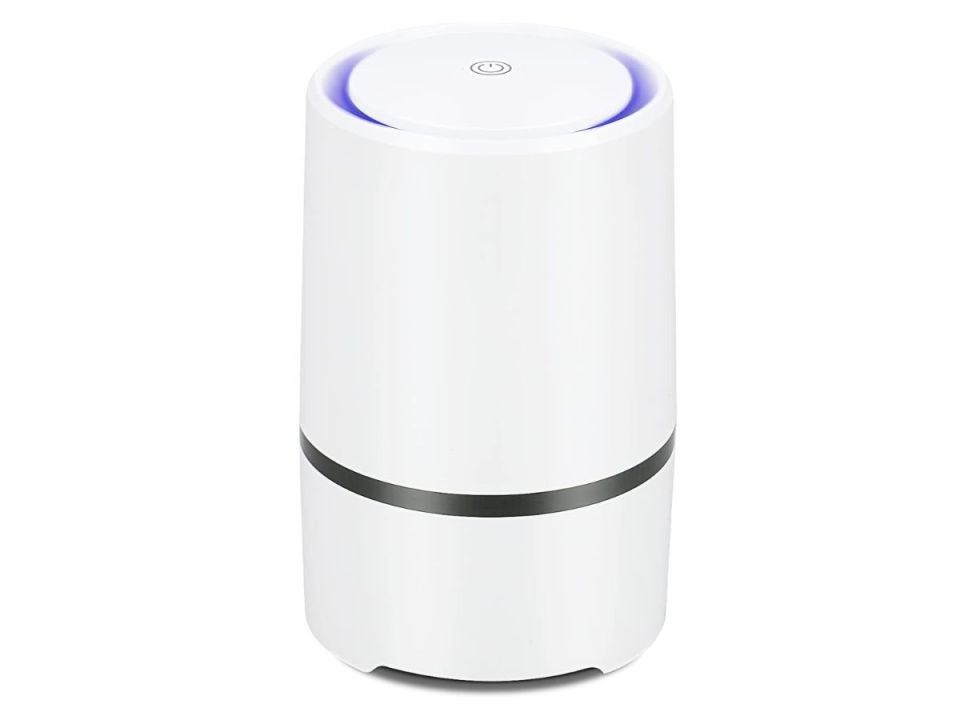 A white cylindrical air purifier with a blue light glowing from its top and a black ring around its middle.