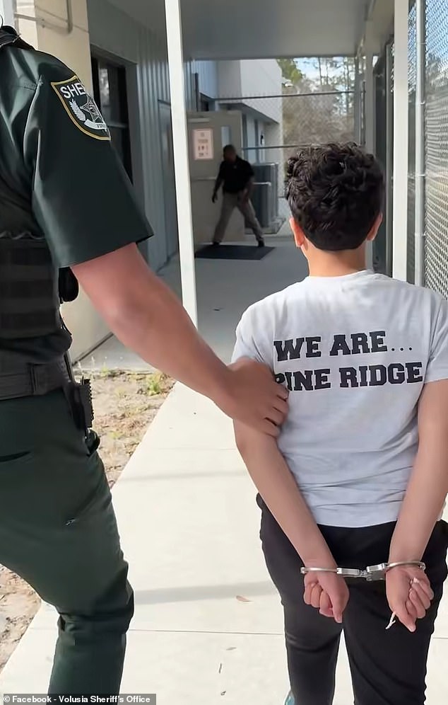 Swinnie was arrested and booked on a felony charge of making a written threat to kill after he left a 'list of people who I'm gunna kill' on his desk at the school