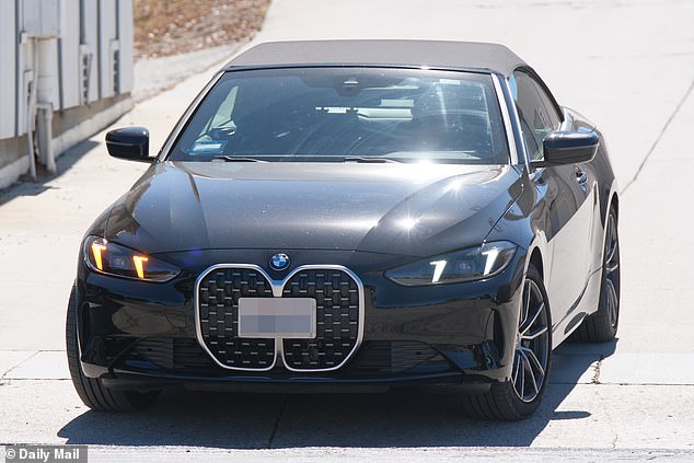 A vehicle that appeared to be Spears's black BMW was pictured being driven off the lot
