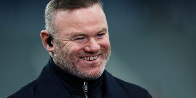 Wayne Rooney smiles as he enjoys takeaway from restaurant part-owned by ex-Man Utd team-mate