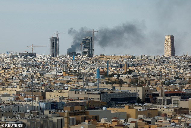 Iran continued to bombard Saudi Arabia with missiles on Thursday. Pictured: Smoke rises above the city, amid the U.S.-Israeli conflict with Iran, in Riyadh, Saudi Arabia