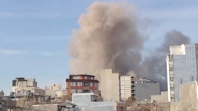 Smoke rises above buildings in Mahabad City after airstrikes on March 6