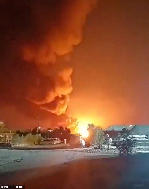 Smoke rises from an explosion in the direction of Ali Al Salem Air Base in Al Jahra, Kuwait