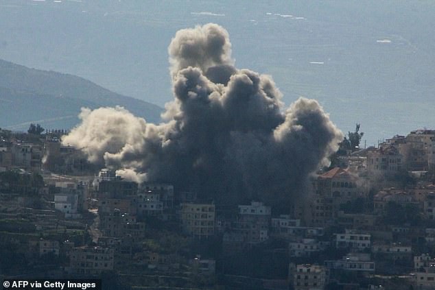 A plume of smoke rises from the site of an Israeli airstrike in the southern Lebanese village of al Khiam on March 6