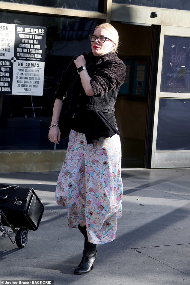 Striding out of court after the ruling, Evans kept her head held high but appeared to be feeling the strain as she pursed her lips and slung her handbag over her shoulder