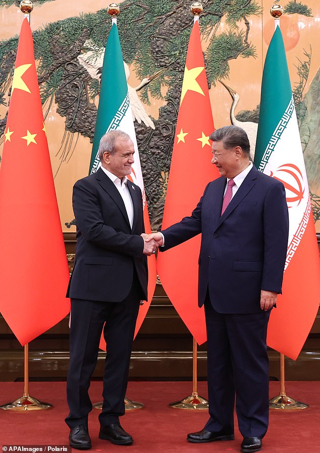 'Iran has become ¿ has made itself ¿ utterly dependent on China,' Haviv writes (pictured: Iranian president Masoud Pezeshkian, left, and Xi Jinping)