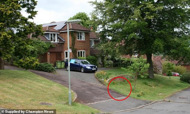 The disputed patch of land (circled) had long been tended by Ms Dobson and her partner