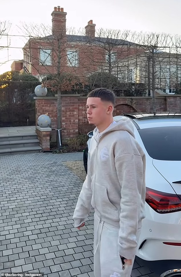 Kai cut a casual figure in a grey tracksuit as the barber parked his car next to the Rooney's fleet of motors, which included two £90,000 Range Rovers