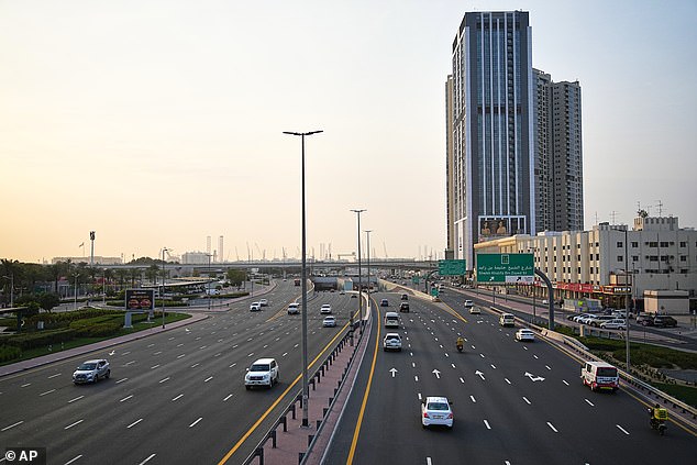 Light traffic moves along a main road in Dubai on Tuesday amid the outbreak of war
