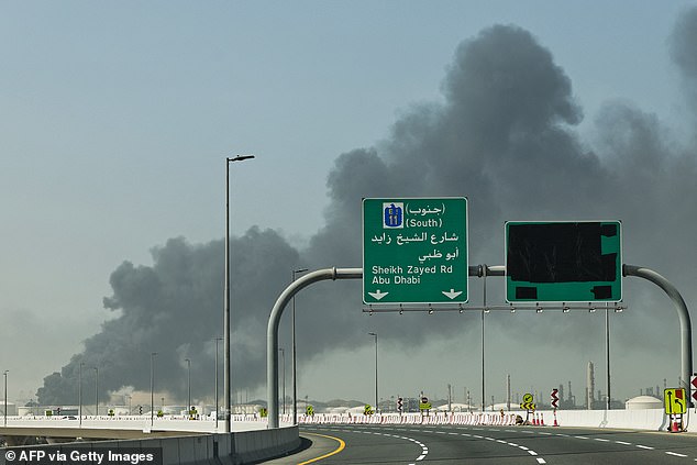 A thick plume of smoke rises from the port of Jebel Ali on the outskirts of Dubai