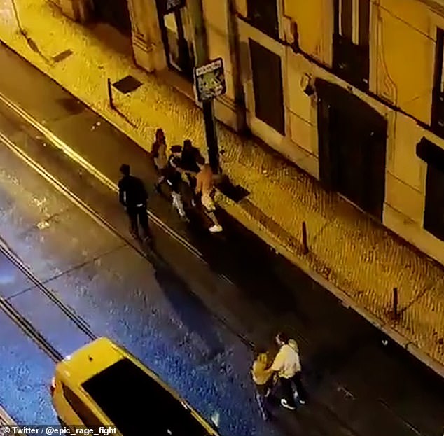 The group, who are British tourists, is seen in an altercation on a Lisbon street around 4:30am on October 14 2023. Daniel is pictured wearing a black top and white trousers