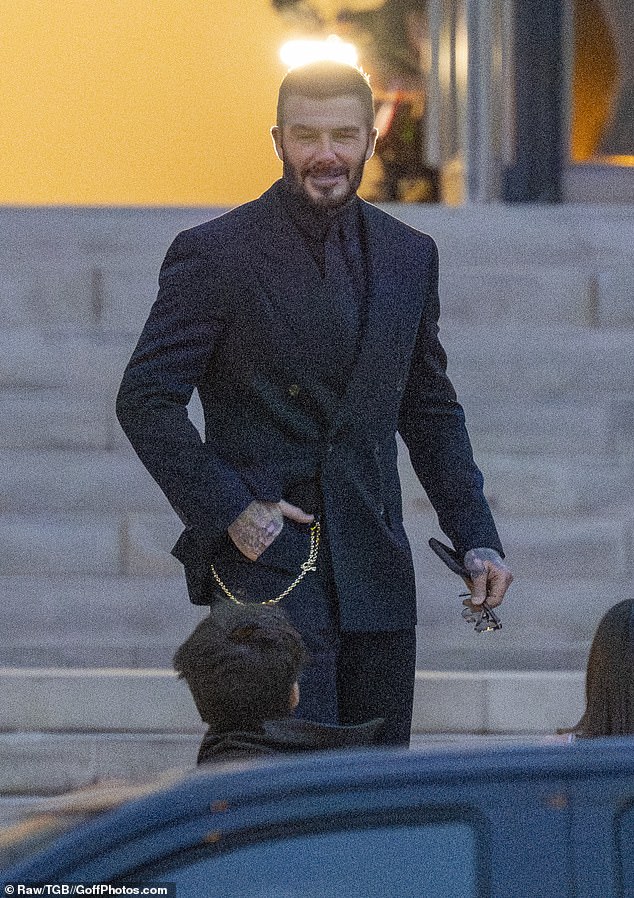 David was beaming with pride as he arrived to support his wife at the fashion show in the French capital