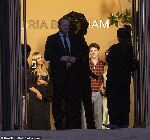 The family were seen posing for snaps together on arrival as they prepared to take their seats for the show