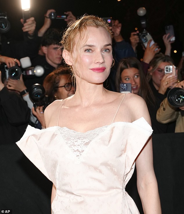 Diane was beaming as she posed for snaps in her Jacquard print gown, with her blonde hair slicked back in a wet look