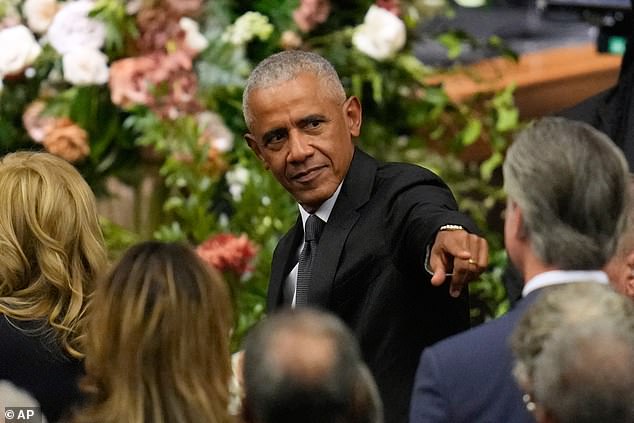 Former President Barack Obama gestures to Gavin Newsom at the funeral for Rev. Jesse Jackson at the House of Hope in Chicago, Friday