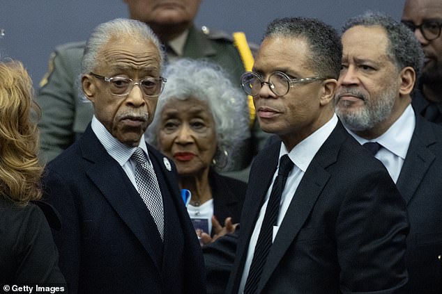 Rev. Al Sharpton speaks with Jesse Jackson Jr. before the start of a celebration of life ceremony for Jackson's father, civil rights leader Rev. Jesse Jackson