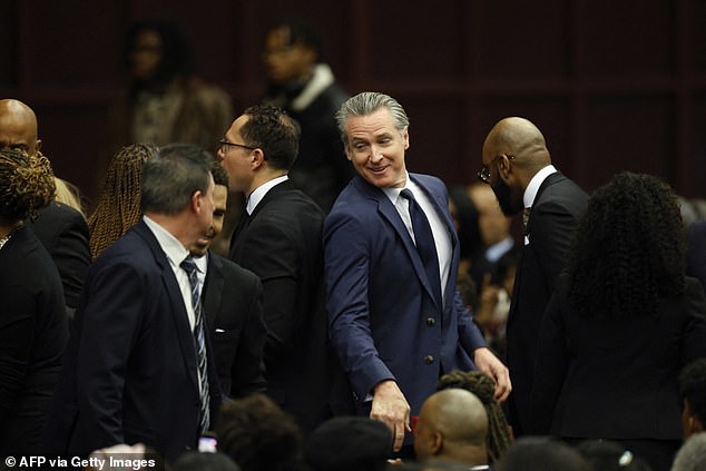 California Governor Gavin Newsom greets attendees during the Public Homecoming and celebration of life for civil rights activist Reverend Jesse Jackson in Chicago, Illinois, on March 6