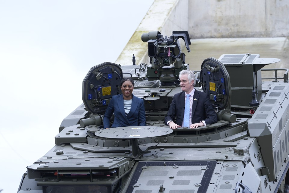 Kemi Badenoch and James Cartlidge in a Boxer tank.