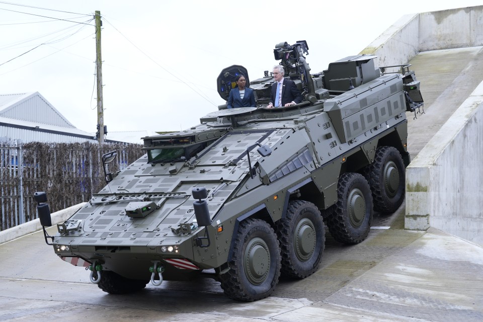 Kemi Badenoch and James Cartlidge in a Boxer tank.