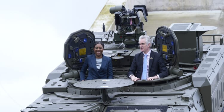 Iran war will spark NEW wave of Channel migrant crossings, warns Kemi as she poses in armoured vehicle