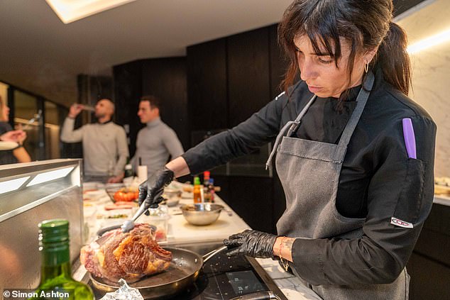 Chefa Miranda, a brilliant private chef, prepares meat for a villa party. Not infrequently, she¿ll serve up dinner for parties of ten or 12, only to discover they¿ve all gone out
