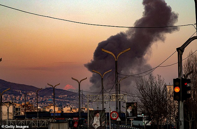 A general view of Tehran with smoke visible in the distance after explosions were reported in the city on March 06, 2026