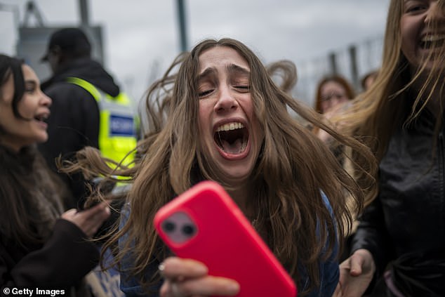 The night saw Harry play tracks from the new album as well as delighting ecstatic fans (pictured) with hits such as Golden and As It Was