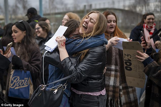 Ecstatic fans are seen crying as they realise they have secured tickets to the gig