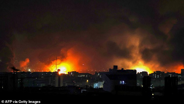Smoke and fire rise from the site of airstrikes at Mehrabad International Airport in Tehran on March 7, 2026. Israel said on March 7 it had launched "broad-scale" strikes on targets in Tehran, as the Iranian state broadcaster reported an explosion in the western part of the city. (Photo by ATTA KENARE / AFP via Getty Images)